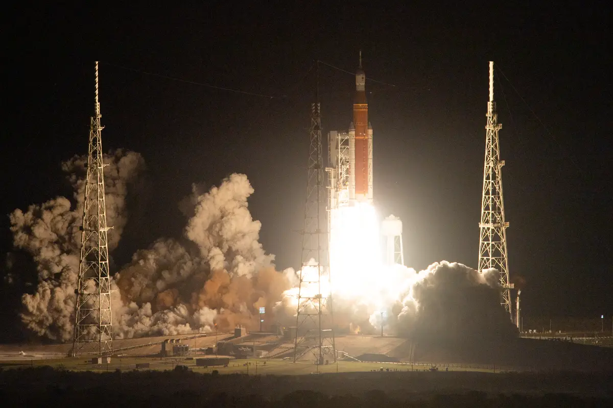 Artemis I rocket launching at night