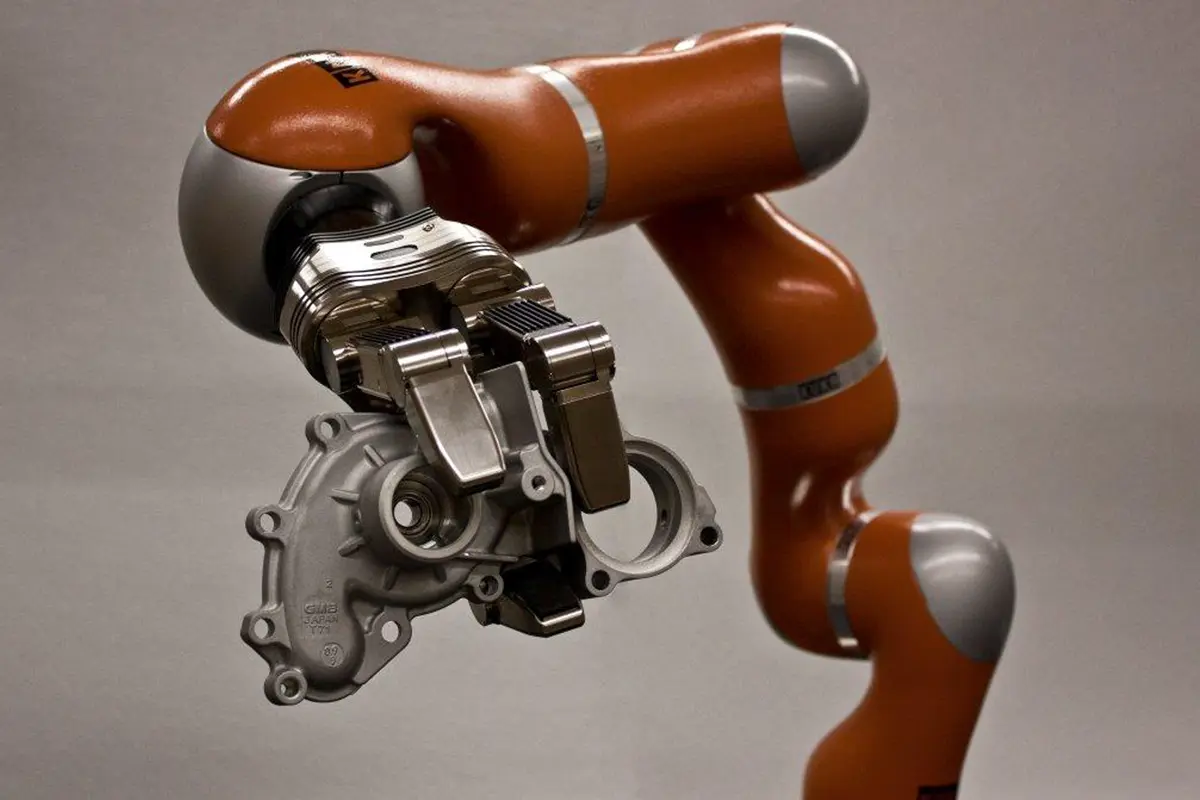 NIST robotic arm holding a metal component